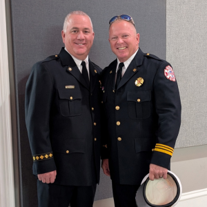 Assistant Fire Chief Gabe Hannah stands with Fire Chief George Edwards